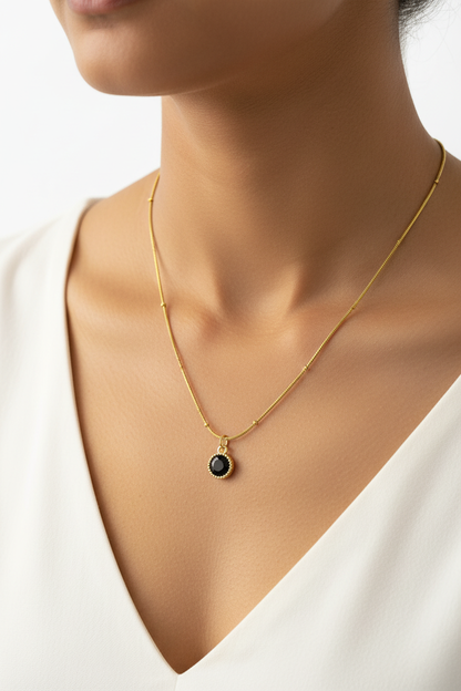 Black Onyx Halo Satellite Necklace – model wearing gold satellite chain with black onyx pendant