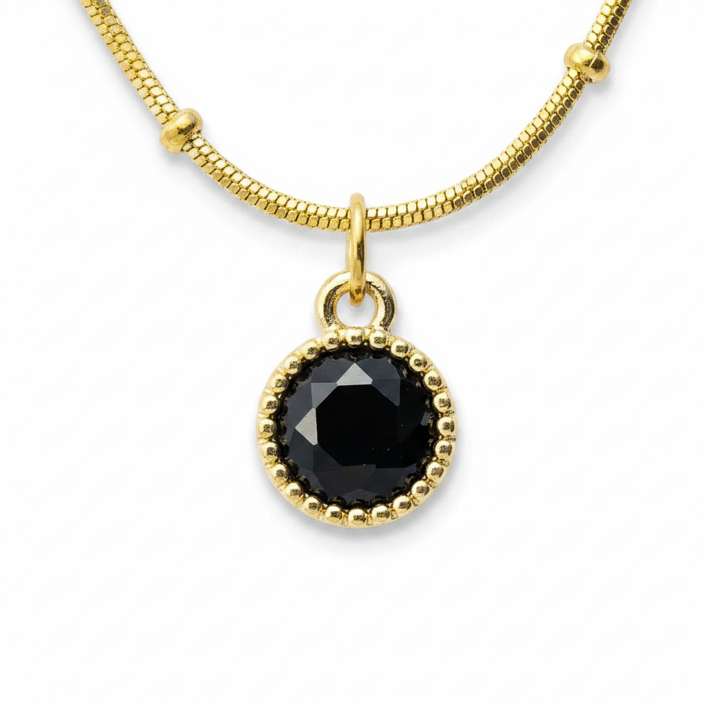 Black Onyx Halo Satellite Necklace – macro close-up of black onyx pendant and gold beaded halo